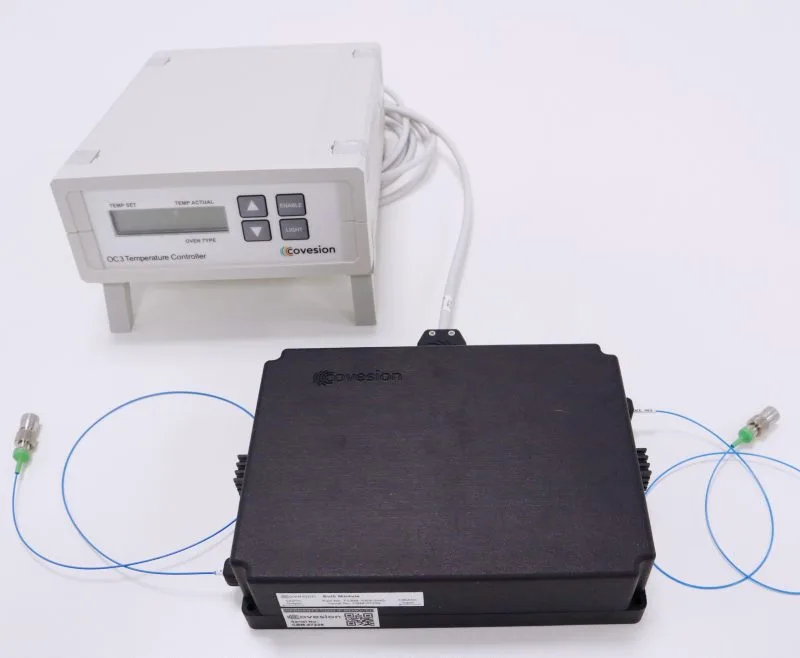 Temperature controller and fiber coupled bulk crystal module connected via cables, representing MgO:PPLN Fiber Coupled Bulk Crystal Modules.